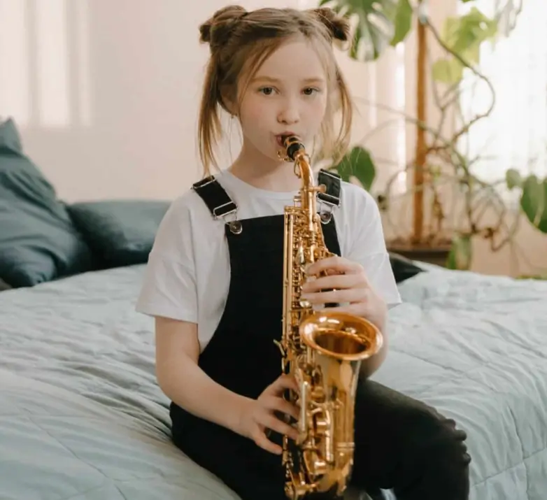 Child playing a saxophone