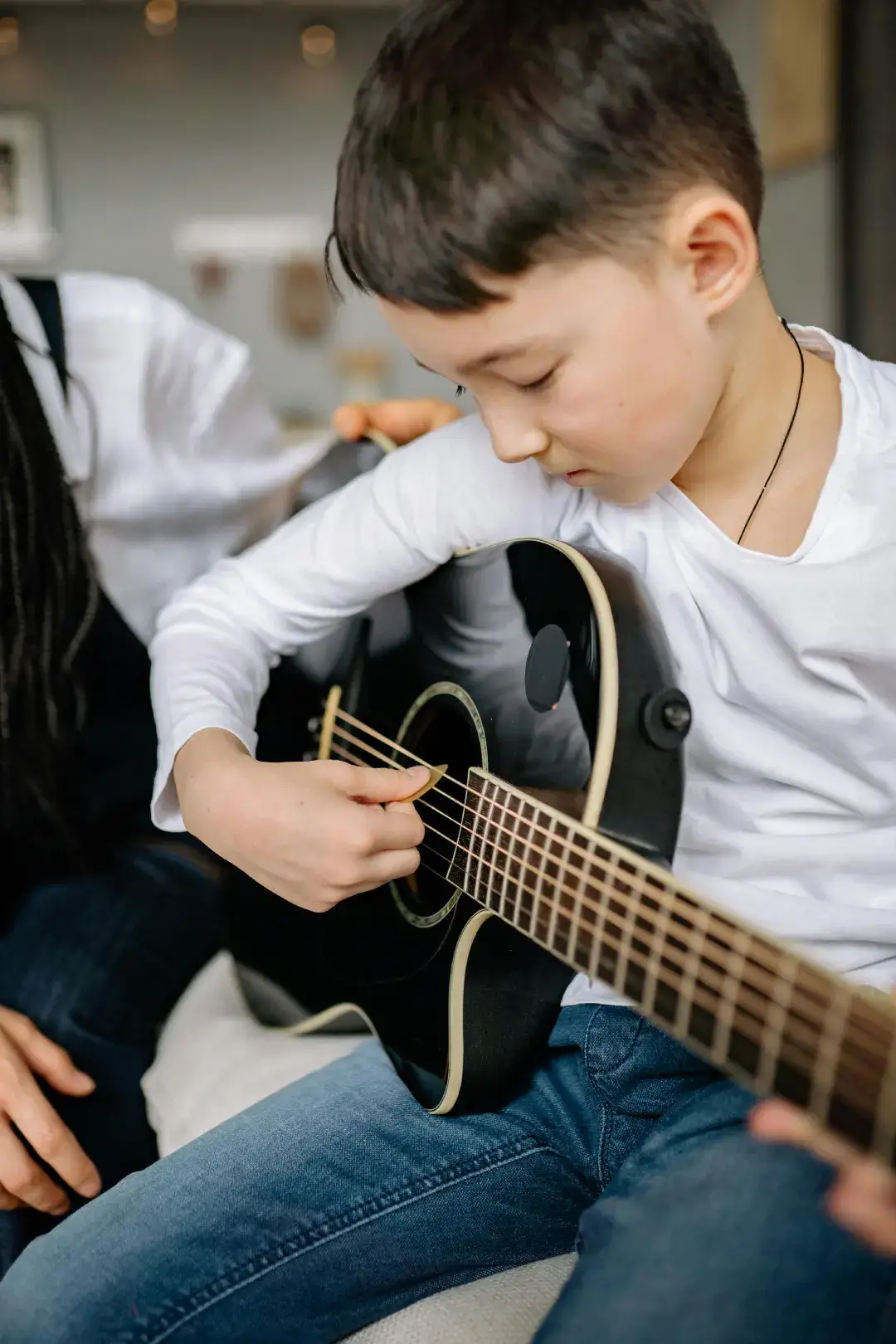 Student playing guitar